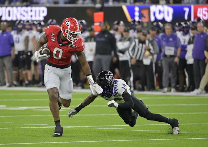 Jan 9, 2023; Inglewood, CA, USA; Georgia Bulldogs tight end Darnell Washington (0) runs the ball against TCU Horned Frogs safety Abraham Camara (14) during the second half in the CFP national championship game at SoFi Stadium. Mandatory Credit: Jayne Kamin-Oncea-USA TODAY Sports